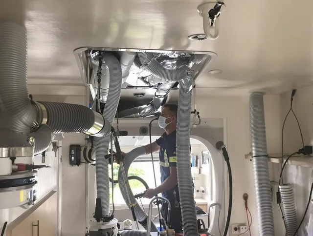 Norwell Air Duct Cleaning specialist performing precise mobile home duct cleaning in Norwell